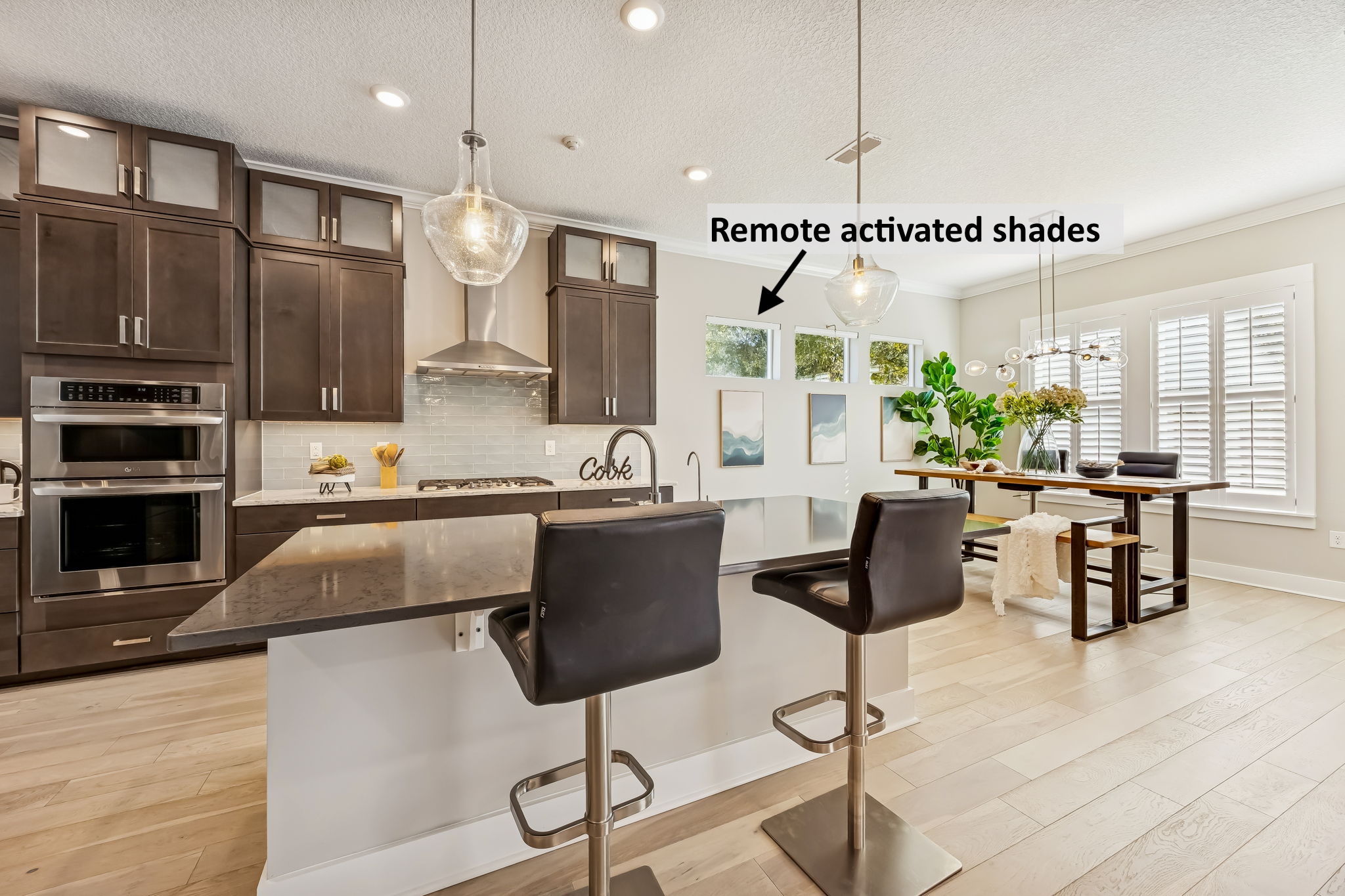 Premium automated shades or plantation shutters adorn all windows ...