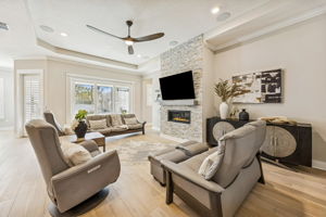 … and is anchored by a dramatic floor-to-ceiling stone accent wall with gas fireplace.