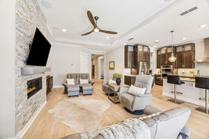 The open concept design connects living, kitchen and dining spaces ...