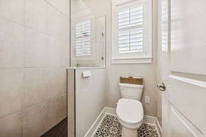 ... a bidet toilet, and elegant tilework throughout the shower and floor
