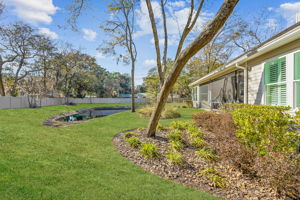 Enjoy a thoughtfully landscaped backyard, fenced for privacy and peace of mind ...