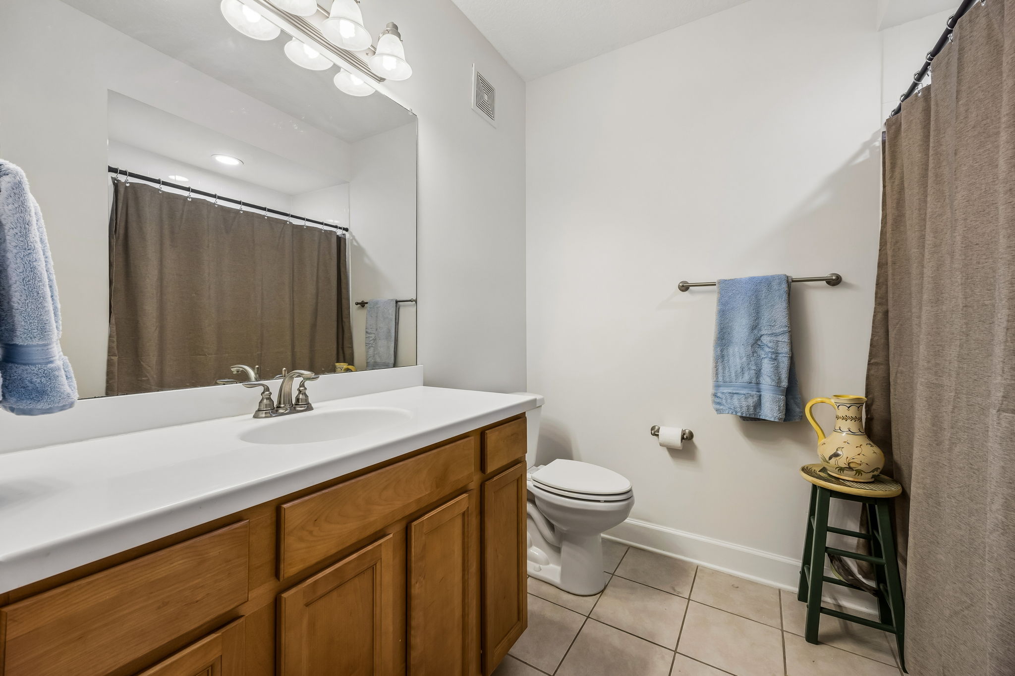 Guest Bathroom with Large Vanity and Tub/Shower Combo.