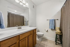 Guest Bathroom with Large Vanity and Tub/Shower Combo.