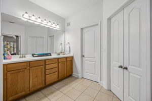 Primary Bathroom with Dual Sink Vanity, Water Closet and Walk-in Closet.
