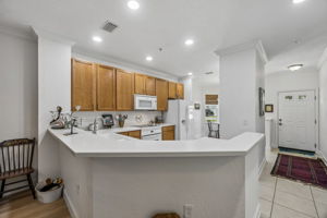 Bright Kitchen with Solid Surface Counters.