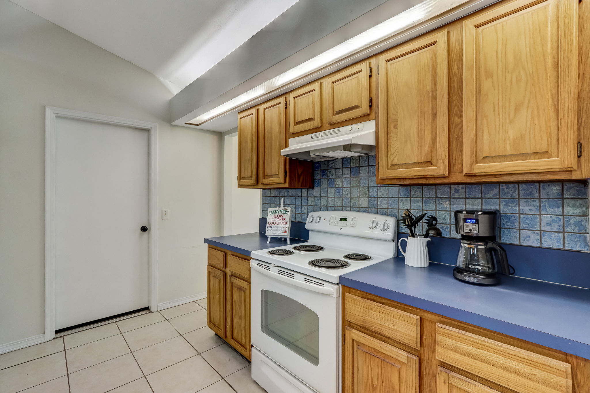 Kitchen is spacious with ample counter space and cabinetry