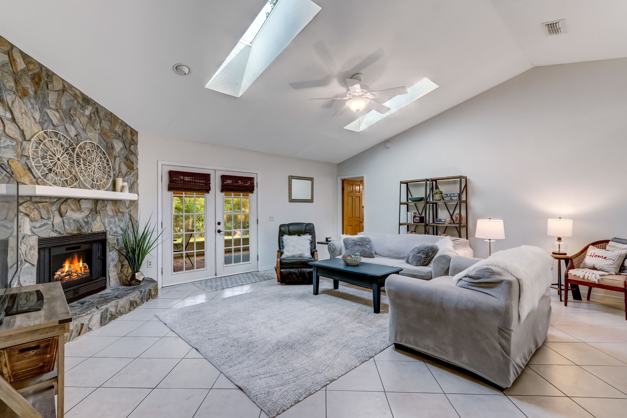 The living area is accented with skylights (recently replaced) and vaulted ceilings ...