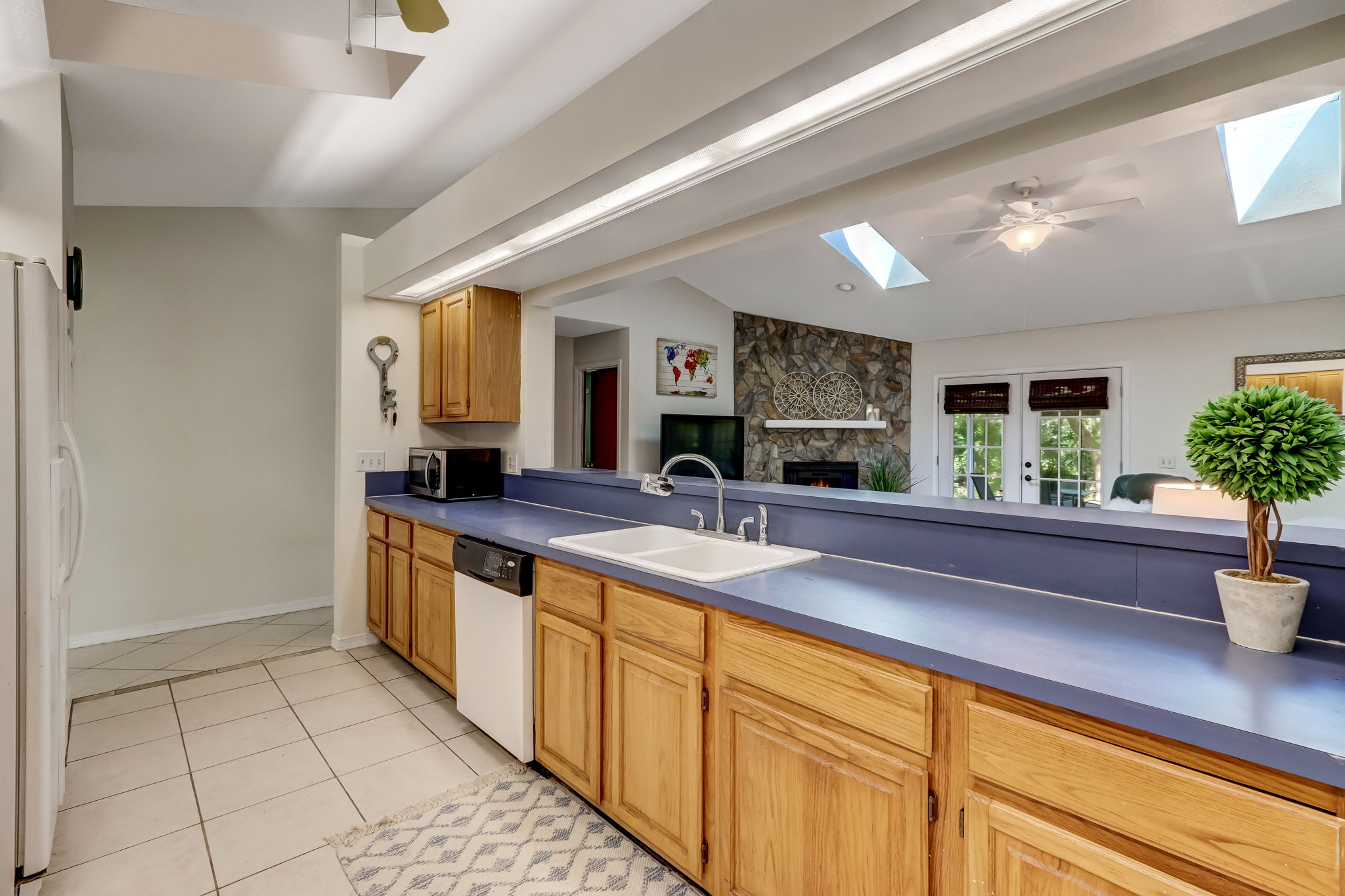 Enjoy eat-in counter bar and open line-of-sight from kitchen to living