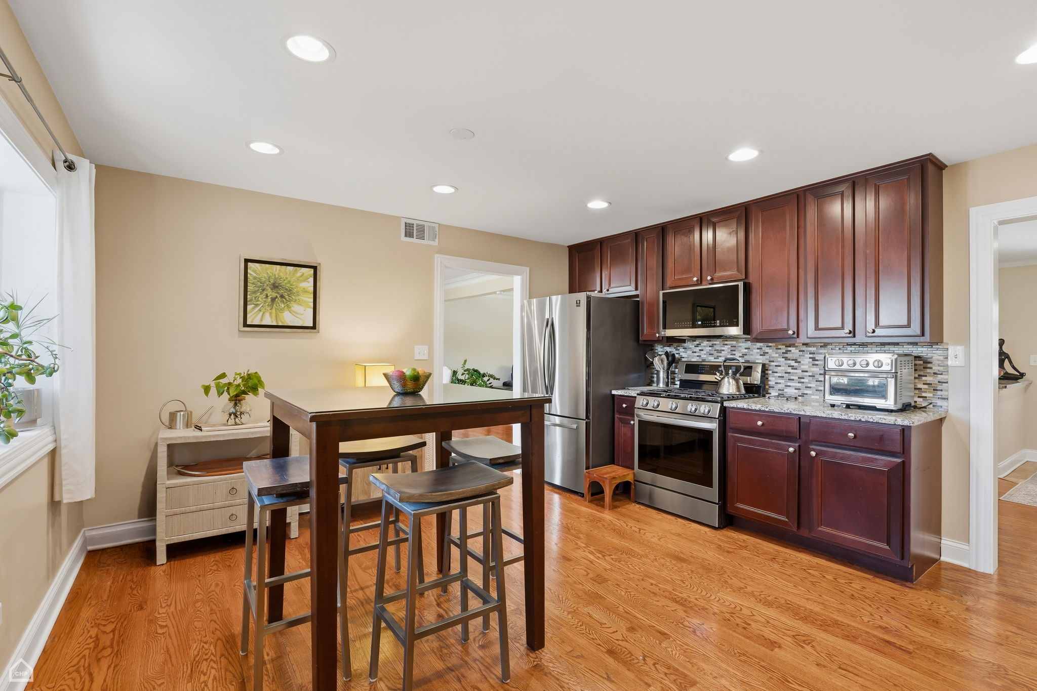 Generous eat in kitchen features stainless steel appliances