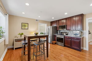 Generous eat in kitchen features stainless steel appliances