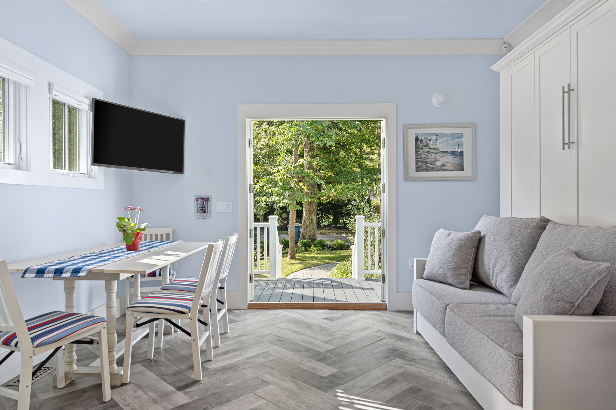 Suite 5 - Herringbone Murphy Bed / Couch and Dining Table