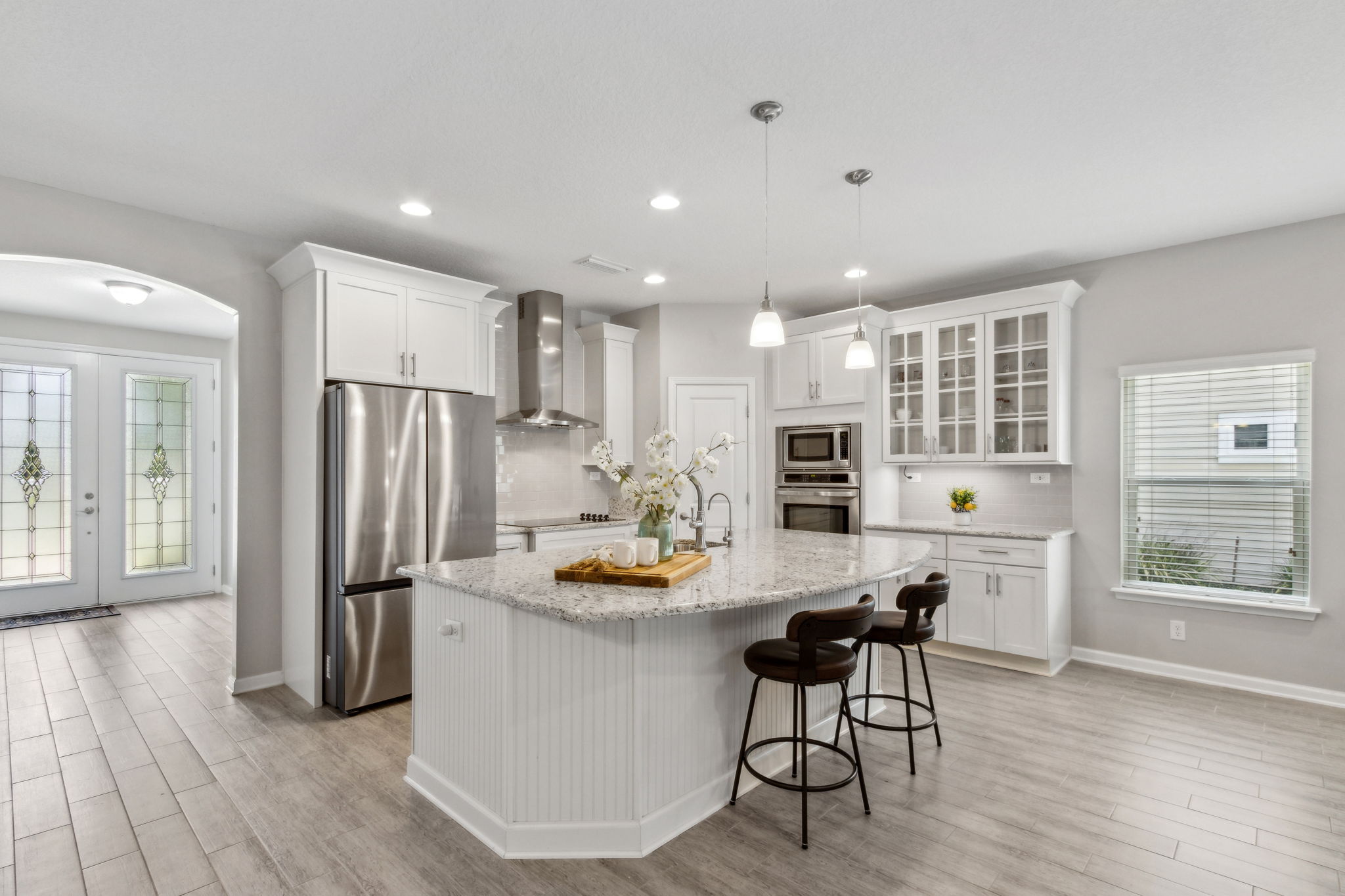 The kitchen is bright and cheery ...