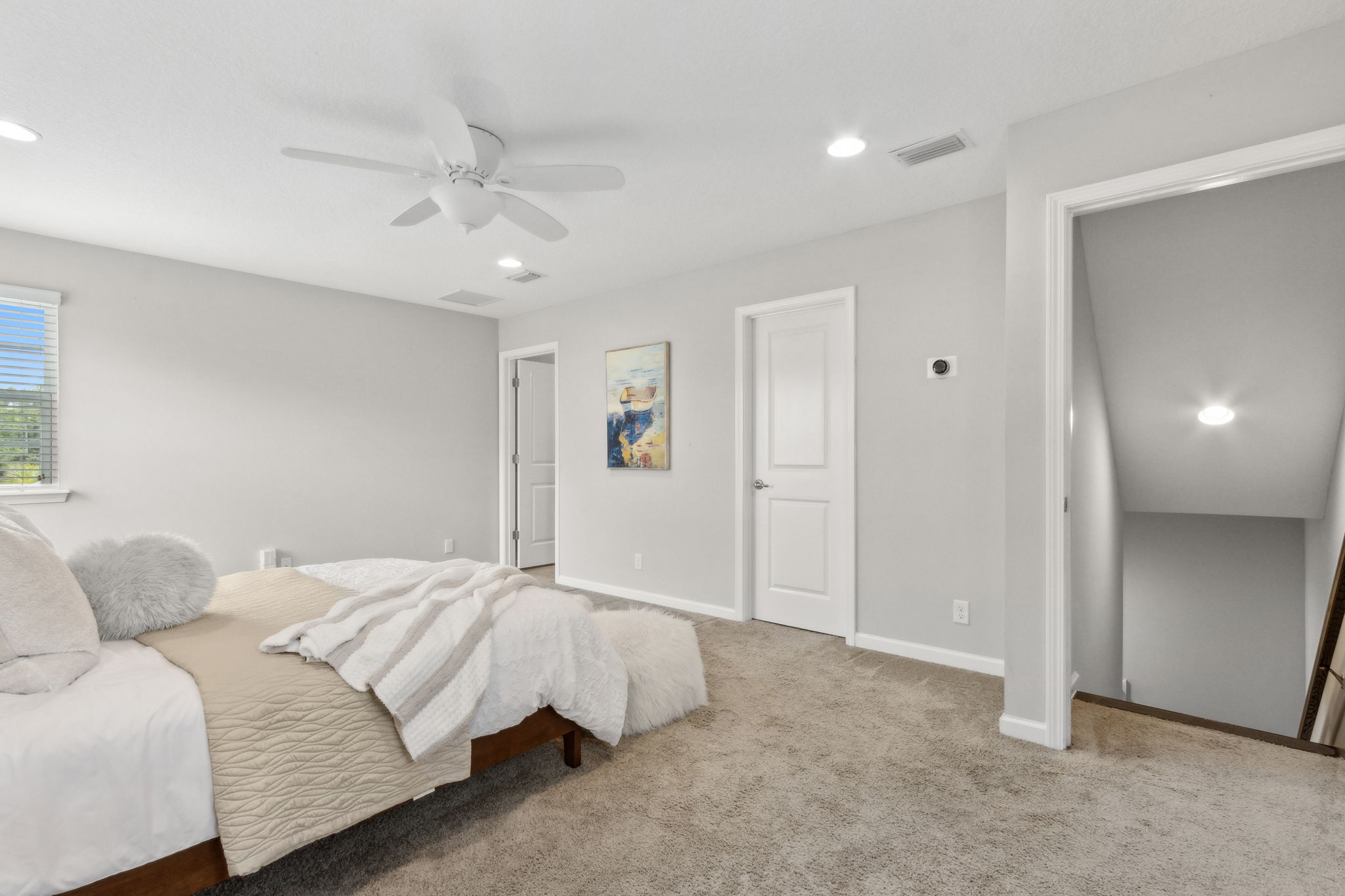 Oversized, it offers room for bed, living furniture and desk, if so desired.