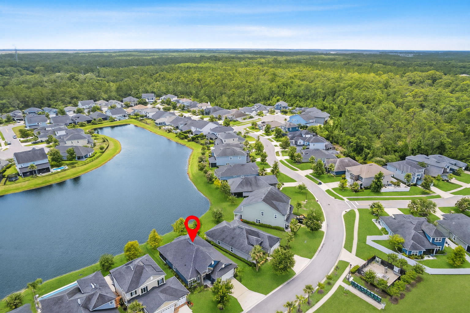 ...facing the lake in the back and a large expanse of community green space in the front.