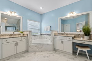 ... with dual large vanities, a make-up area, garden soaking tub ...