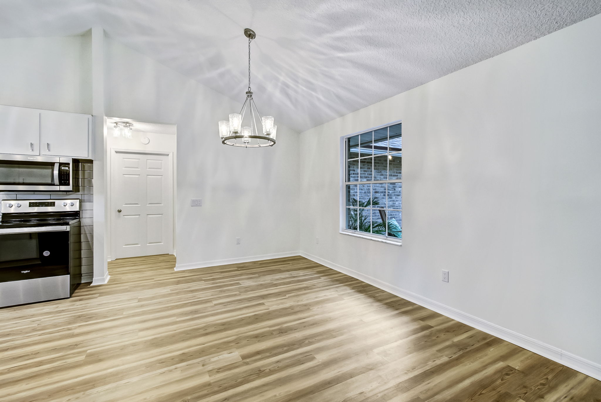 Dining Area with door to Laundry Room in background