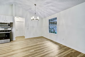 Dining Area with door to Laundry Room in background