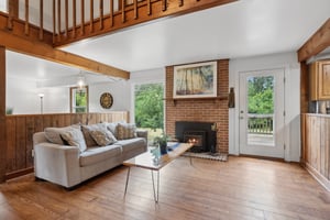 Family Room with Fireplace and Deck Access