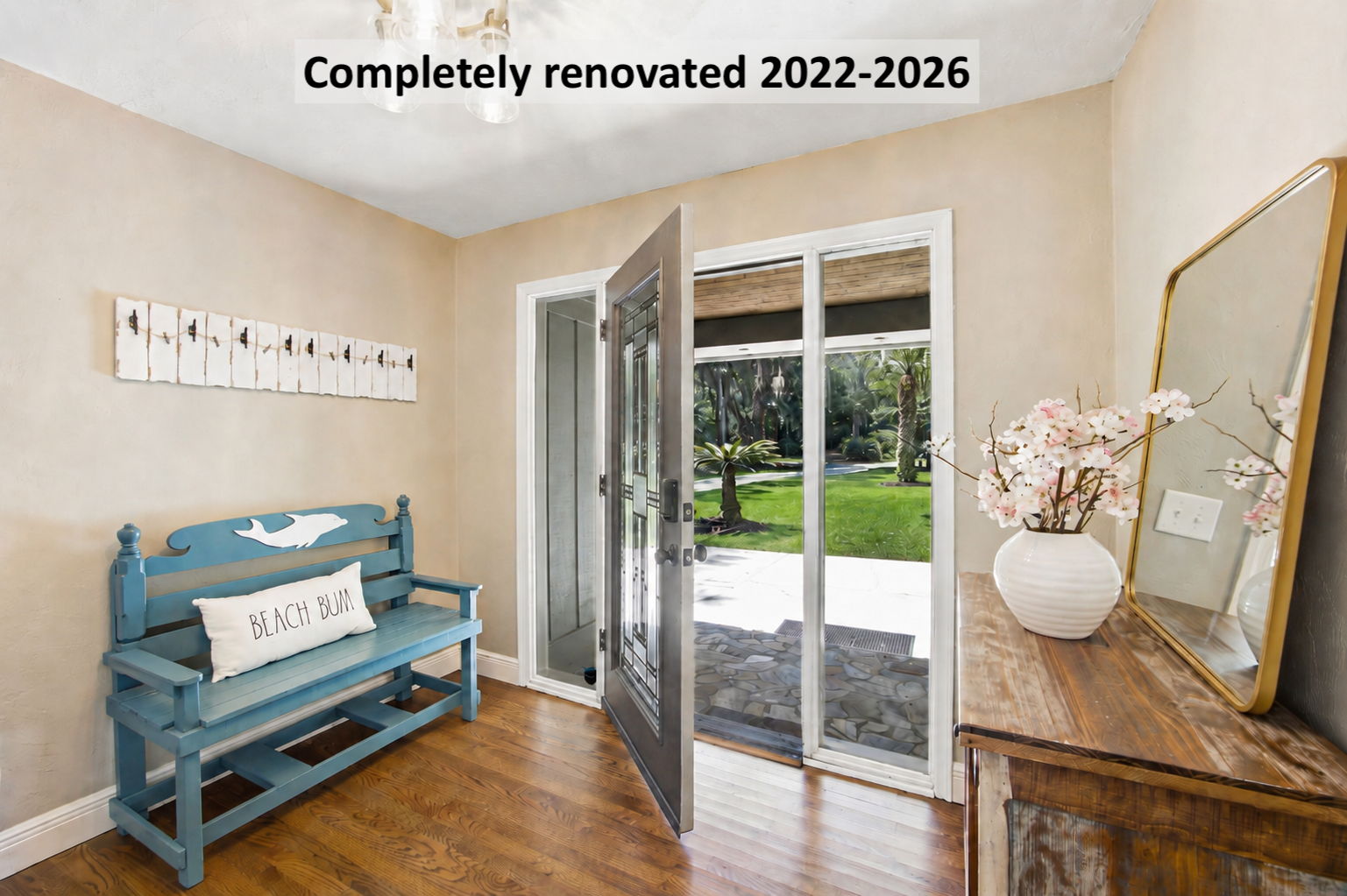 Inside, a thoughtfully renovated home begins with a warm welcome and beautifully preserved oak hardwood floors