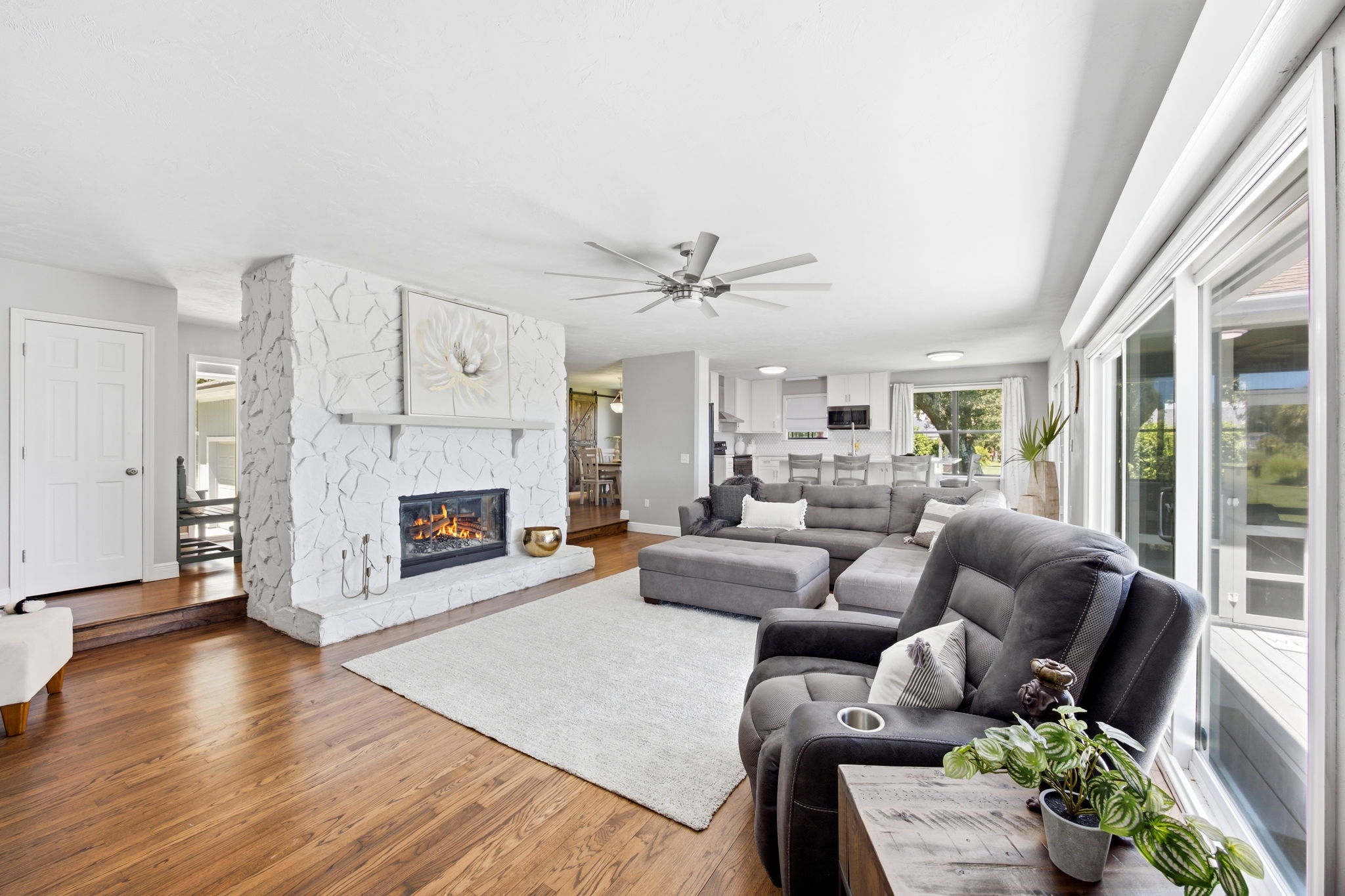 … while the home’s clean finishes allow the oak floors and natural setting to take center stage
