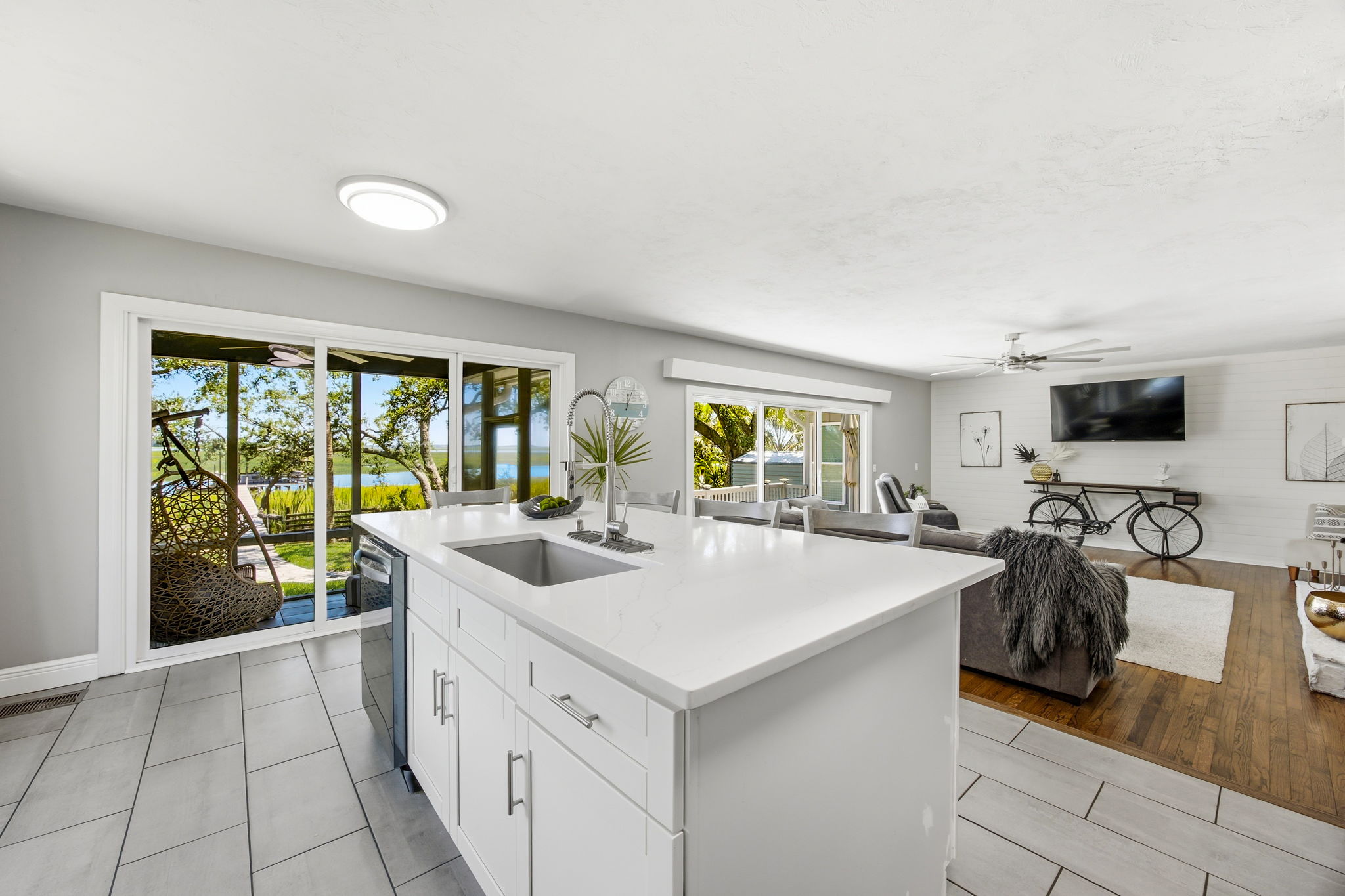 … where expansive glass frames the marsh and water, keeping the natural setting present throughout the day