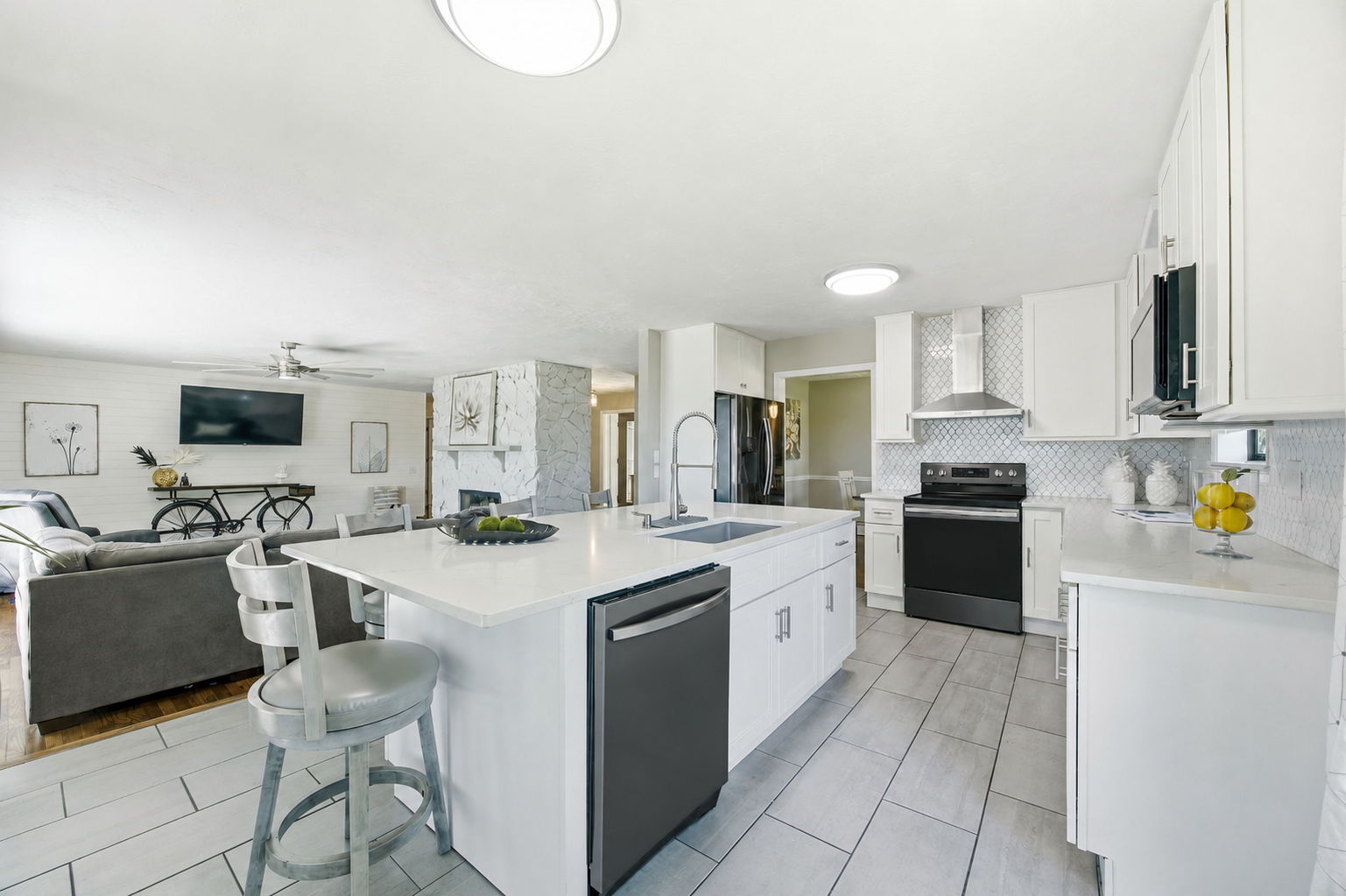 Open to the living room, the island creates an easy transition between cooking, gathering and relaxing