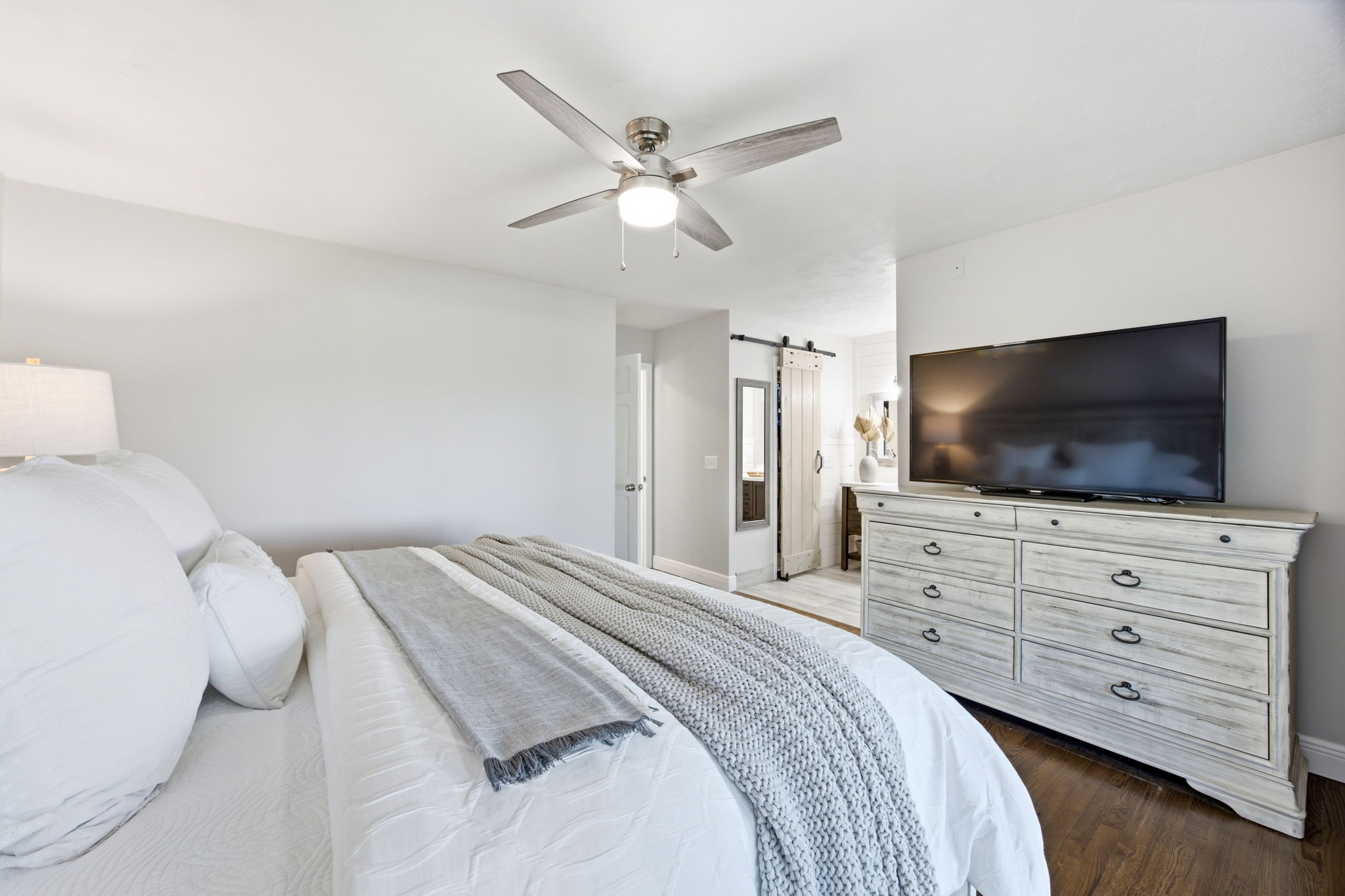 A generous layout leaves room to unwind, with the renovated bath and sun porch both just steps away