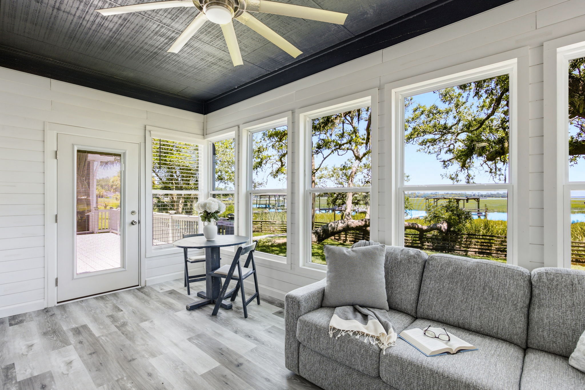 A door to the deck extends this peaceful space outdoors, keeping the waterfront always within easy reach