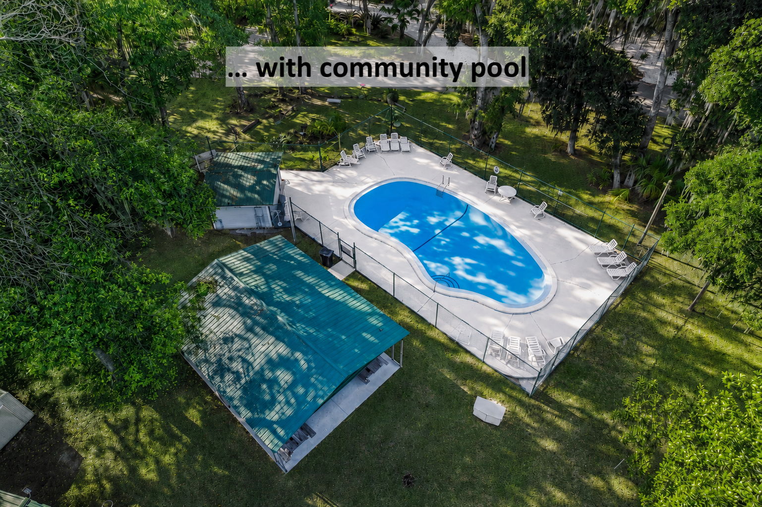 … with a community pool tucked beneath the trees for relaxed afternoons close to home