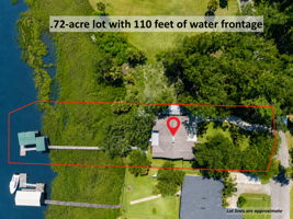 Set on .72 acres with 110 feet of waterfront, this private retreat stretches from shaded lawn to the water’s edge