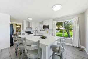 A spacious island offers abundant prep space and comfortable seating for casual meals and conversation