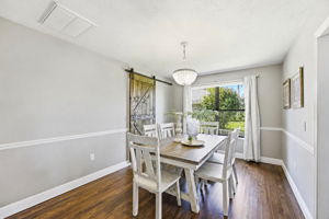 Just off the kitchen, the dining room offers a warm, comfortable setting for everyday meals and relaxed gatherings