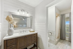 … creating a calm transition from the bedroom to the separate bathing area just beyond