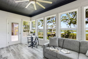 A door to the deck extends this peaceful space outdoors, keeping the waterfront always within easy reach