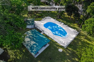 … with a community pool tucked beneath the trees for relaxed afternoons close to home