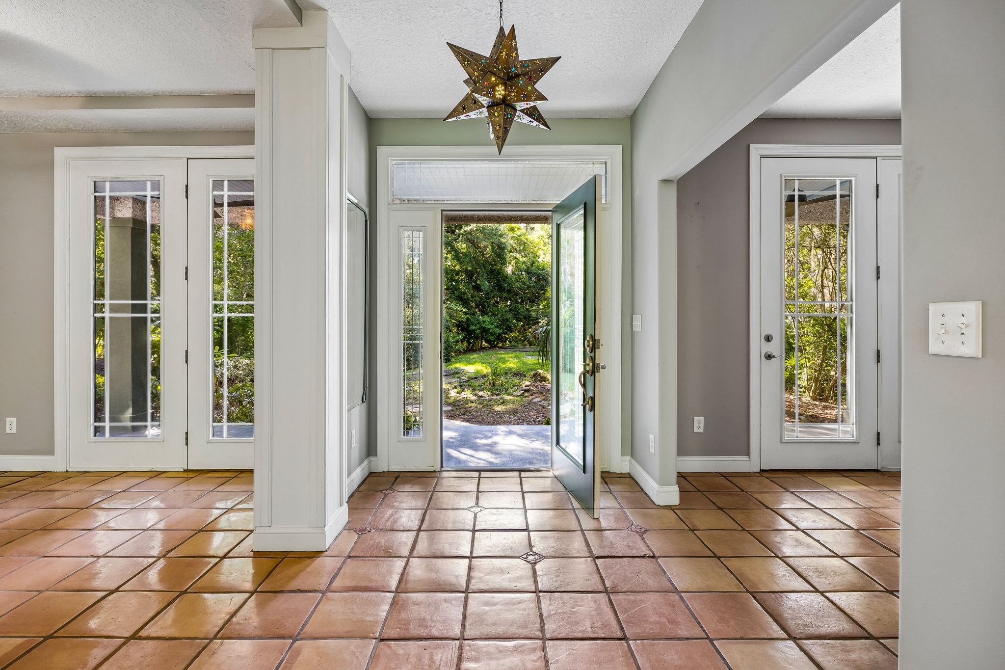 Foyer with Dining Room to the left and Office/Den to the right