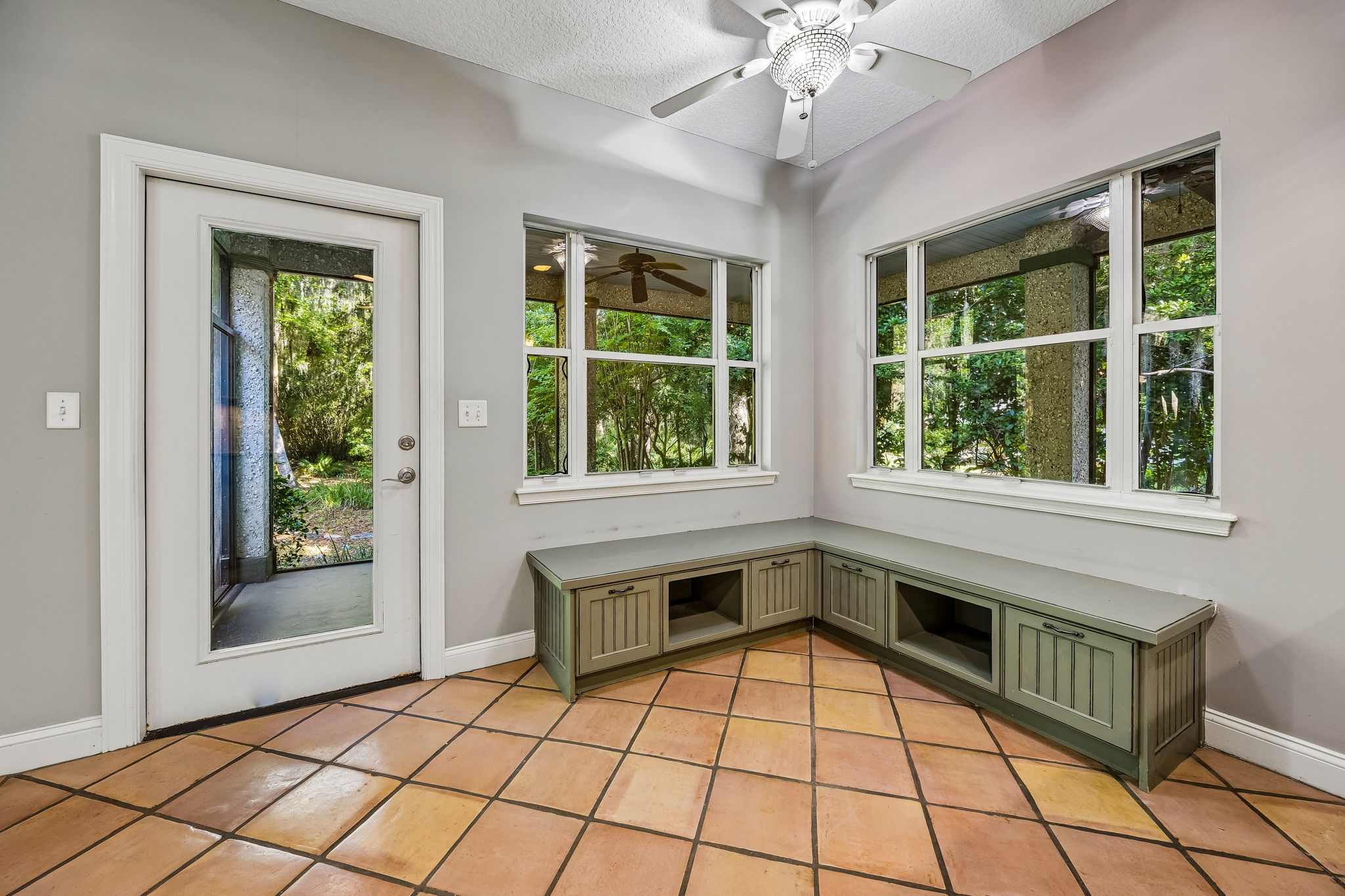 Kitchen Banquette Seating with access to wrap around screen porch