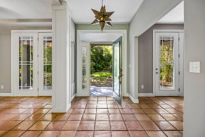 Foyer with Dining Room to the left and Office/Den to the right