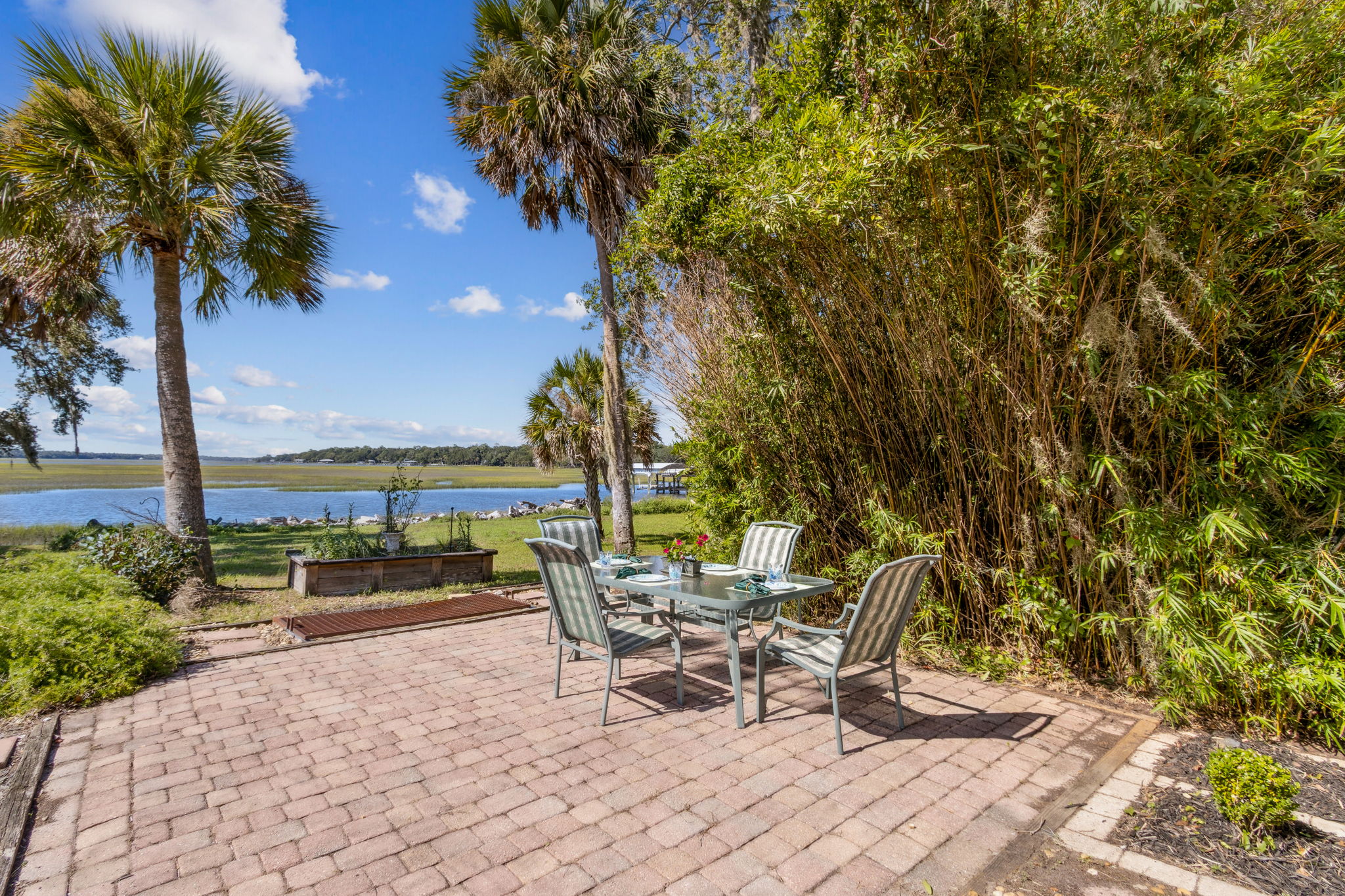 Outdoor Waterfront Living Area with Pavers