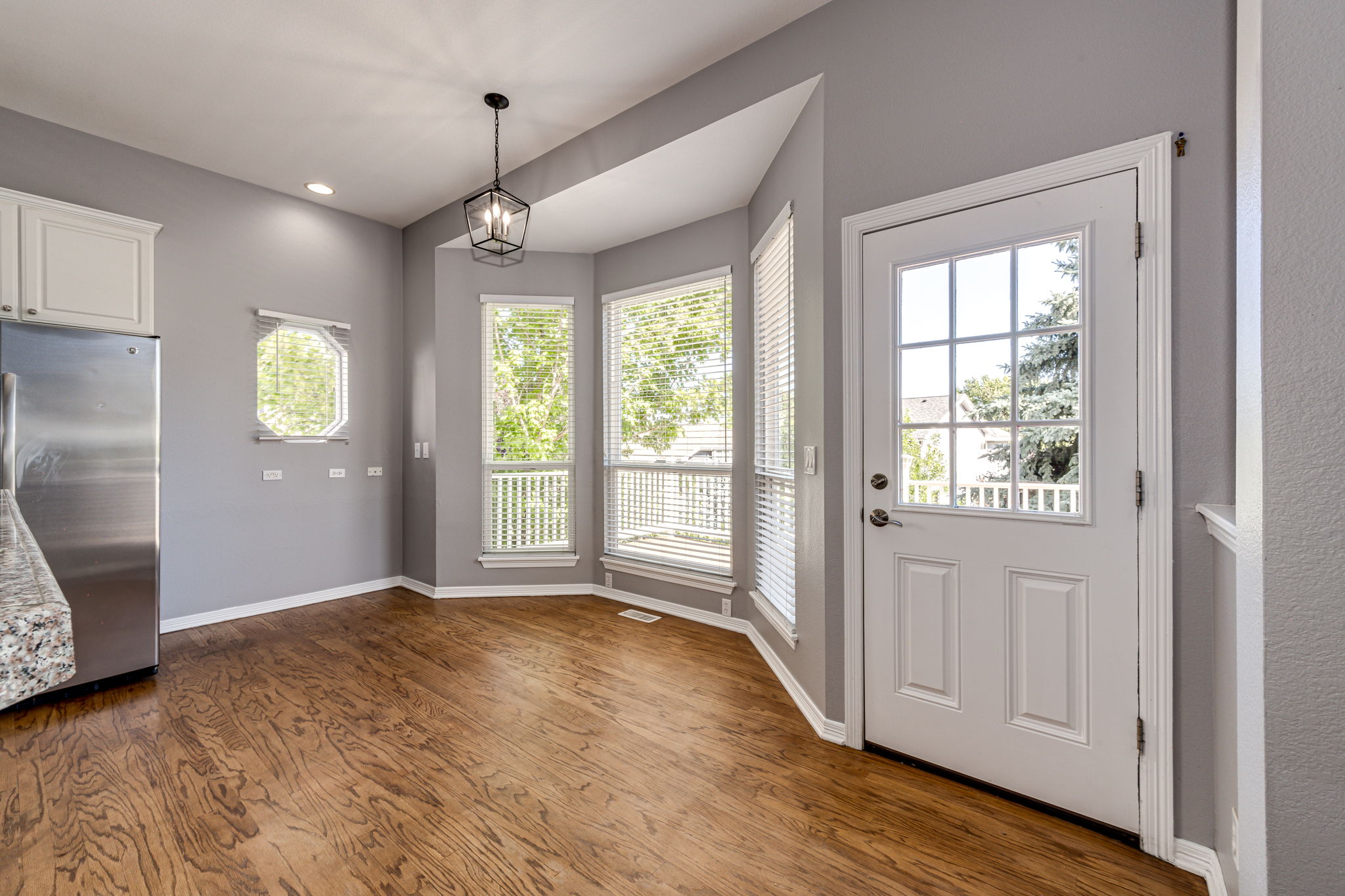 Eat-in space off of the kitchen with a door leading out onto the upper level deck area