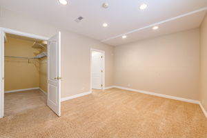 4th bedroom in the basement with a big walk in closet and bathroom