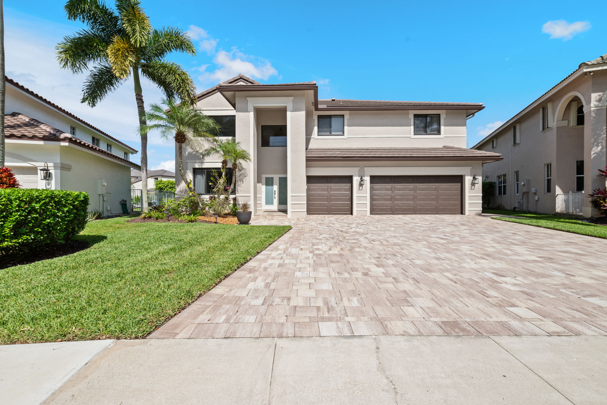 6-car paver driveway and 3-Car Garage