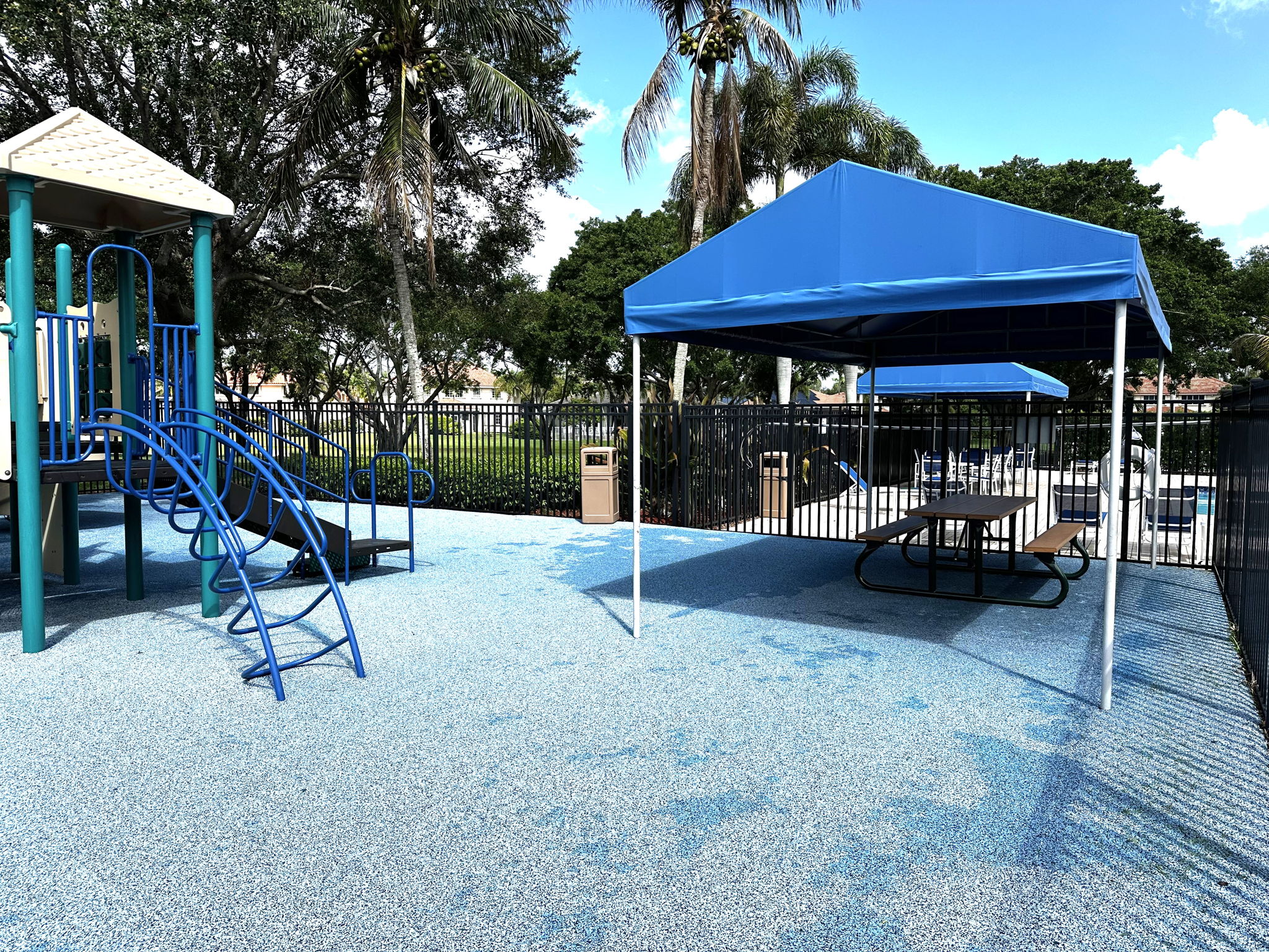 Canopy shaded picnic table at the tot lot
