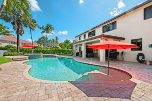 The shallow platform entry with built-in sunbrella is a great spot to splash in the cool water with the little ones