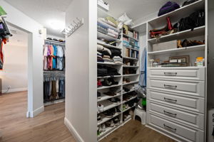 Owner's suite walk-in closet features every type of built-in storage you need