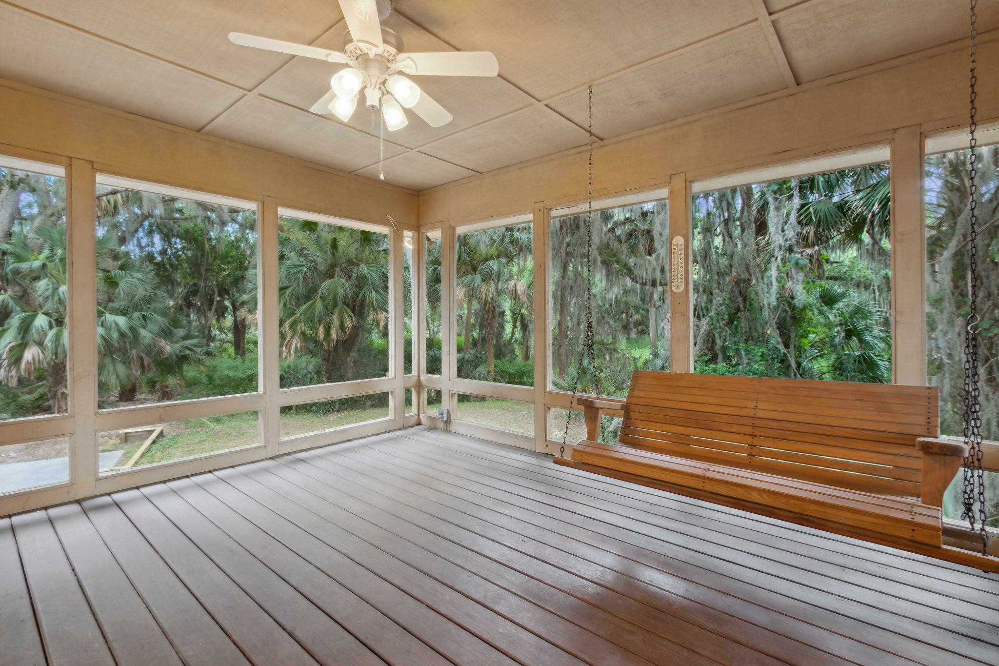 Screened-in Porch with hand-crafted swing made with love