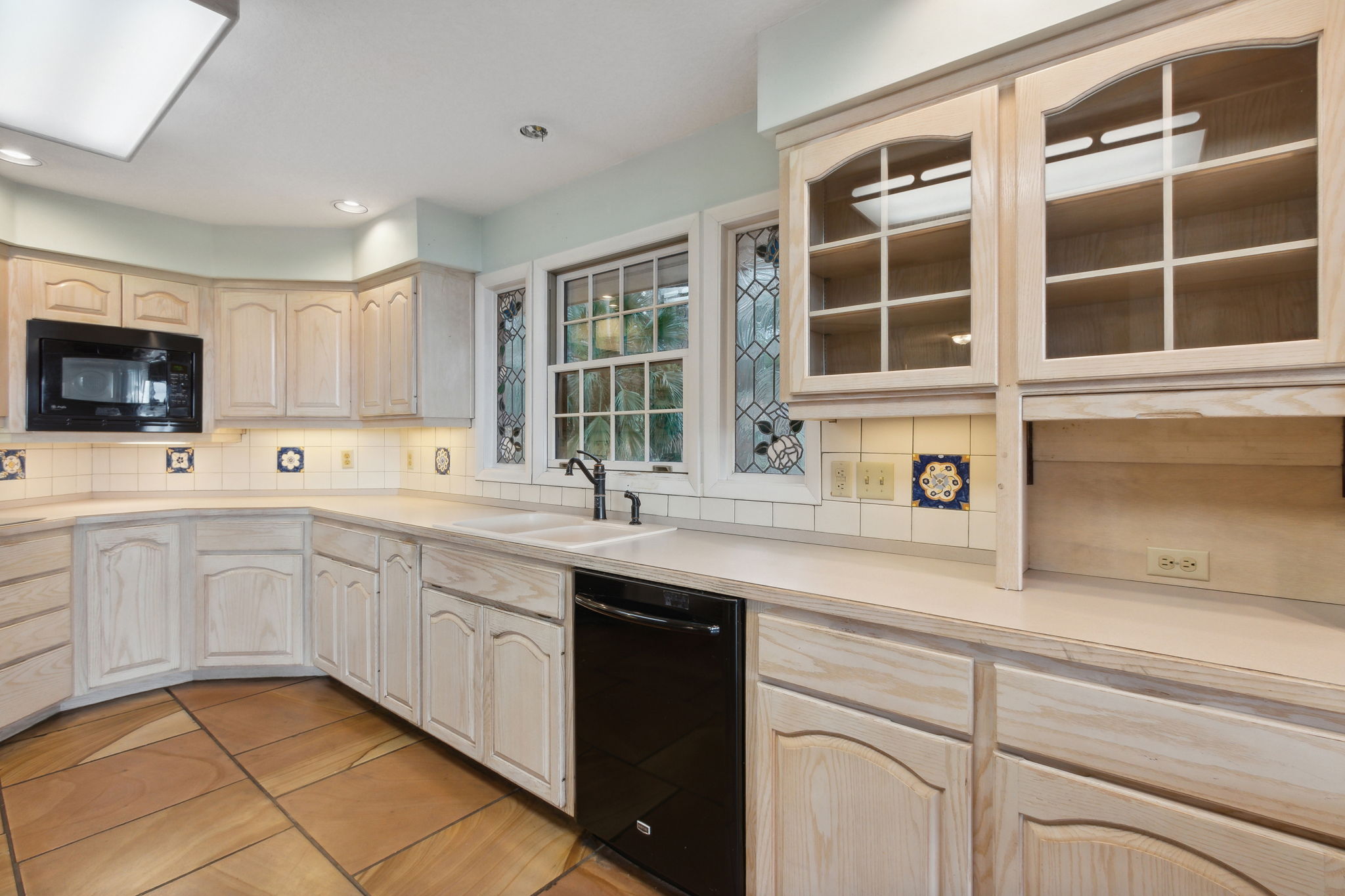 Kitchen with hand painted family heirloom tile inserts