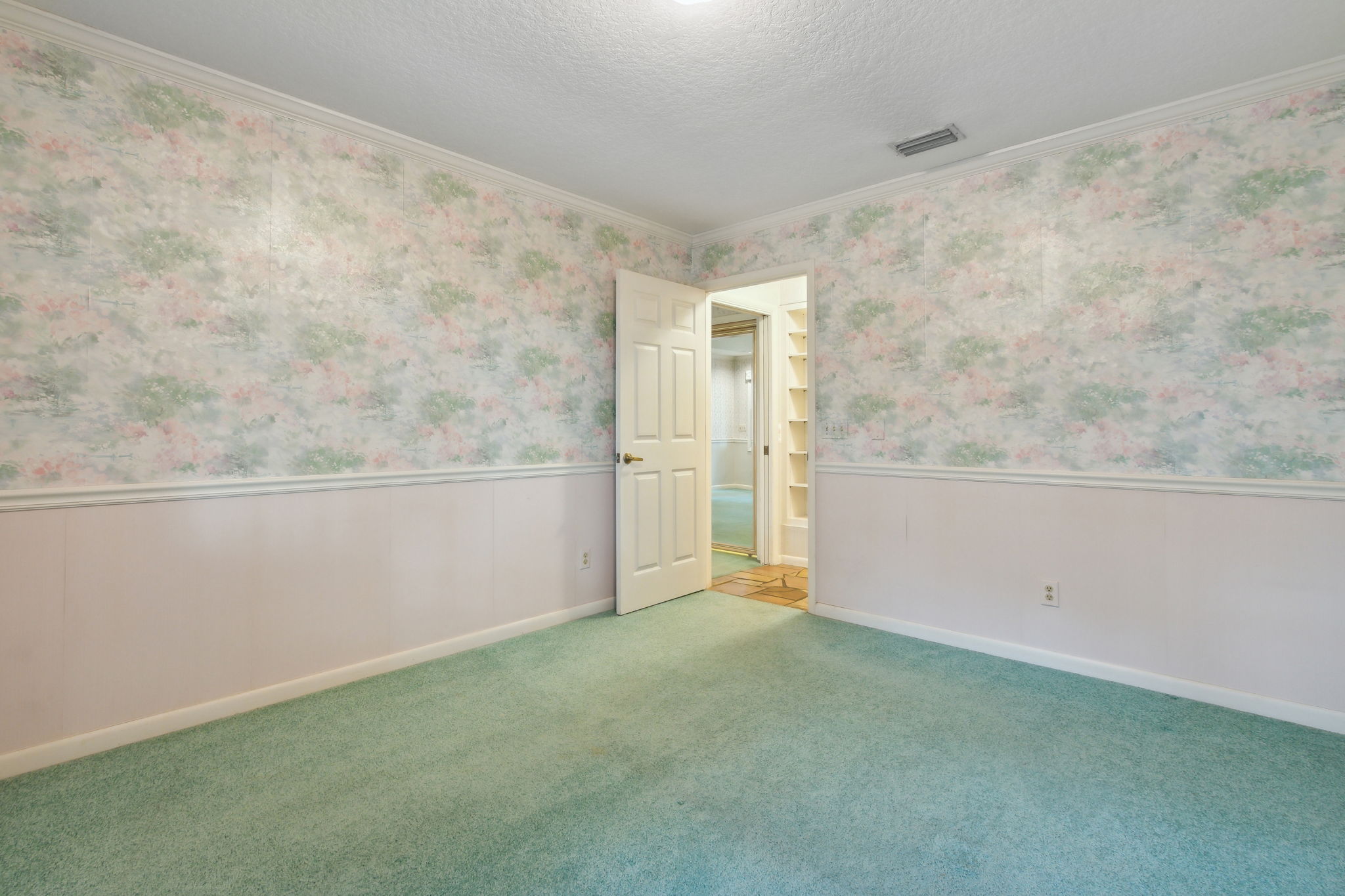 Bedroom 2  and you can catch a glimps of built-in shelving in the hallway