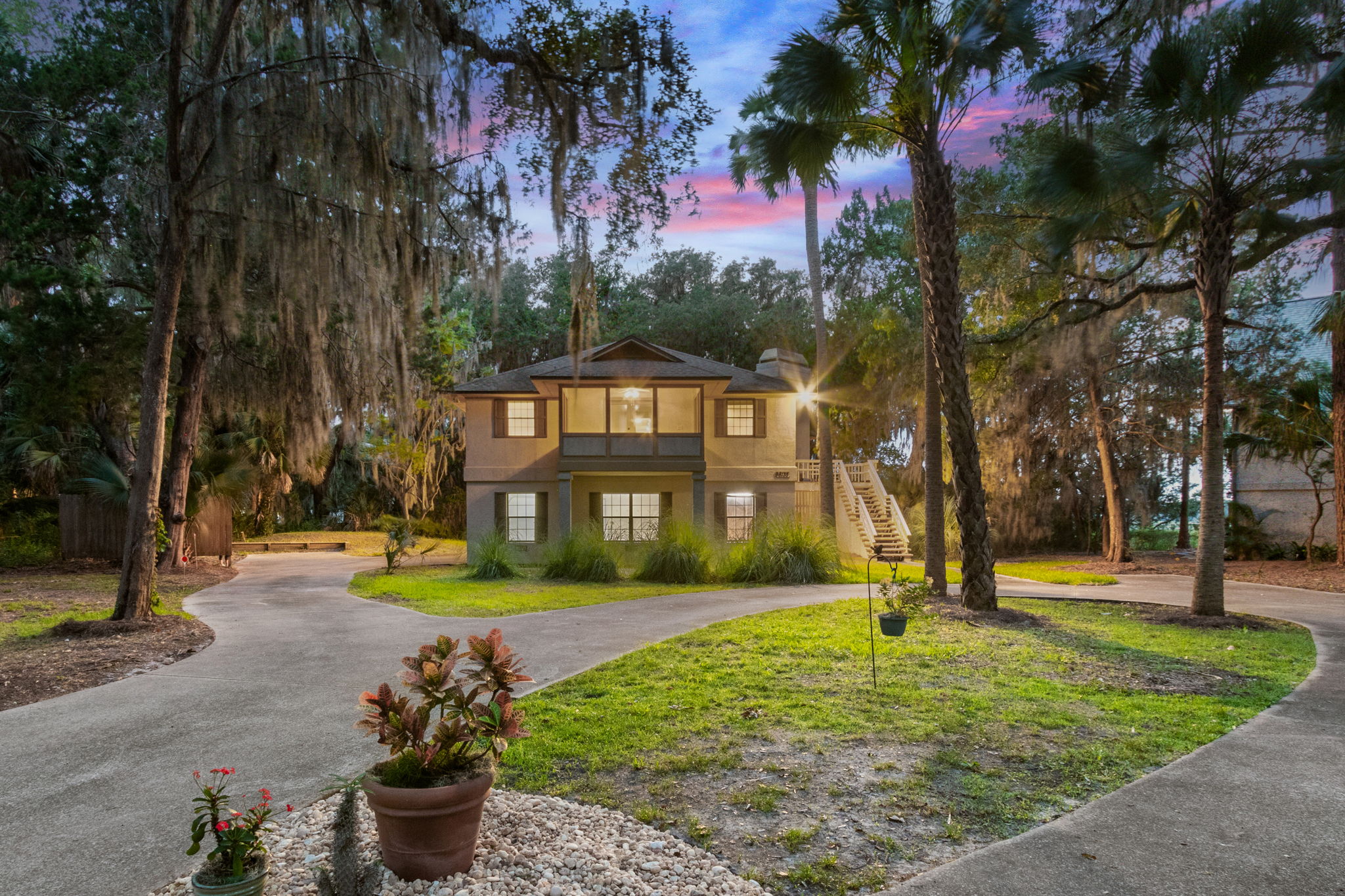 Warm and Welcoming View from circular driveway with additional parking area