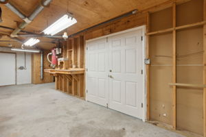 Double doors leading to the 2 car garage